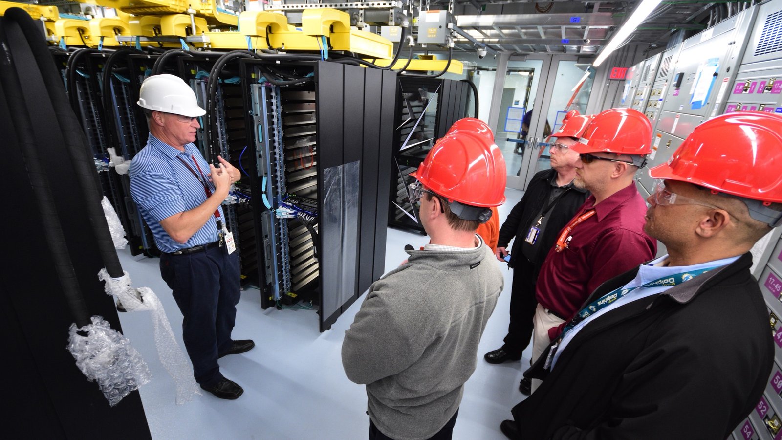 A U.S. Department of Energy team views Summit supercomputer equipment at Oak Ridge National Laboratory.