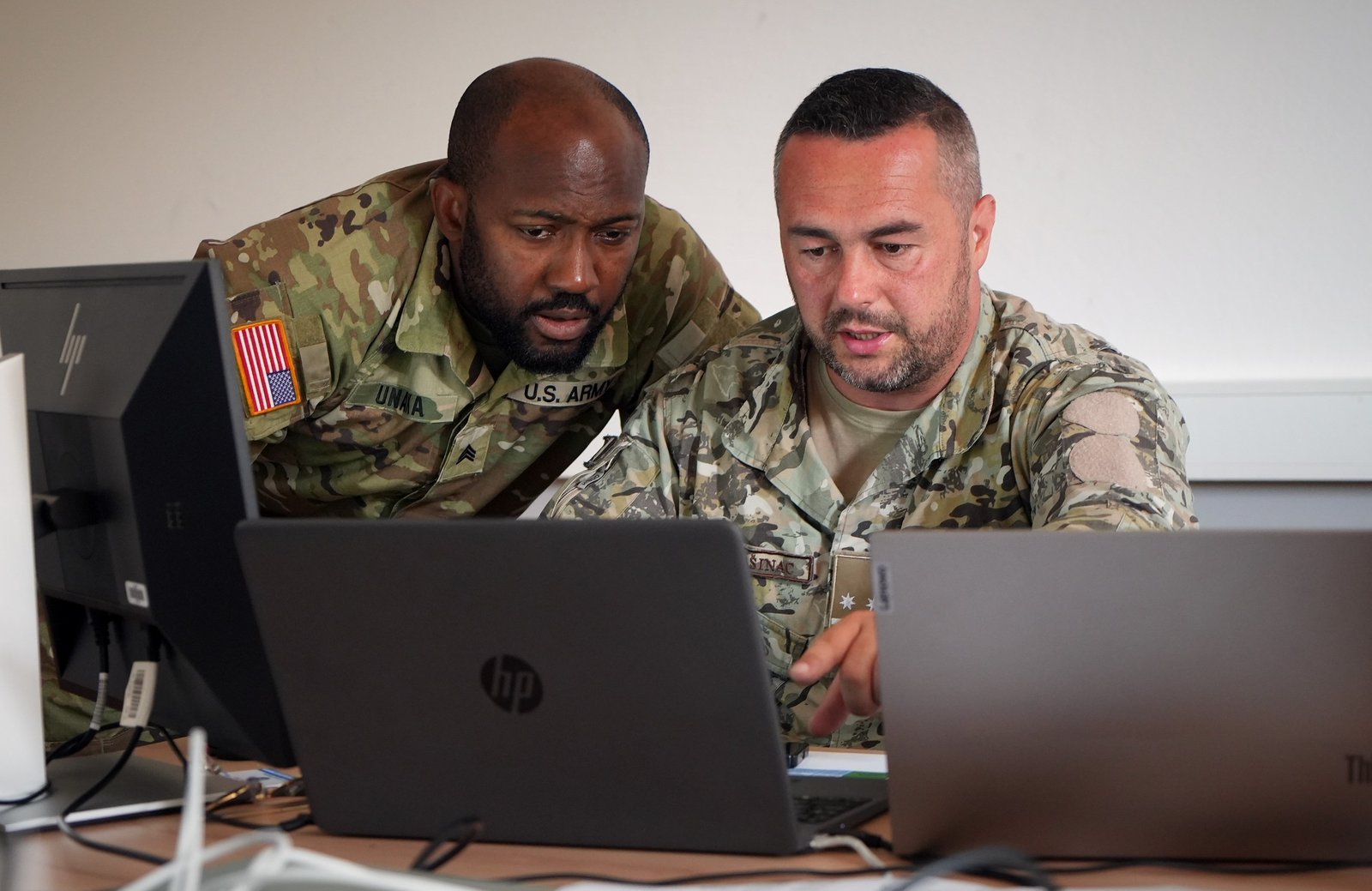 Cyber threat intelligence analysts from the Maryland Army National Guard and the Armed Forces of Bosnia and Herzegovina work as a blue team during the Adriatic Regional Security Cyber Cooperation exercise in Slovenia in July 2024.
